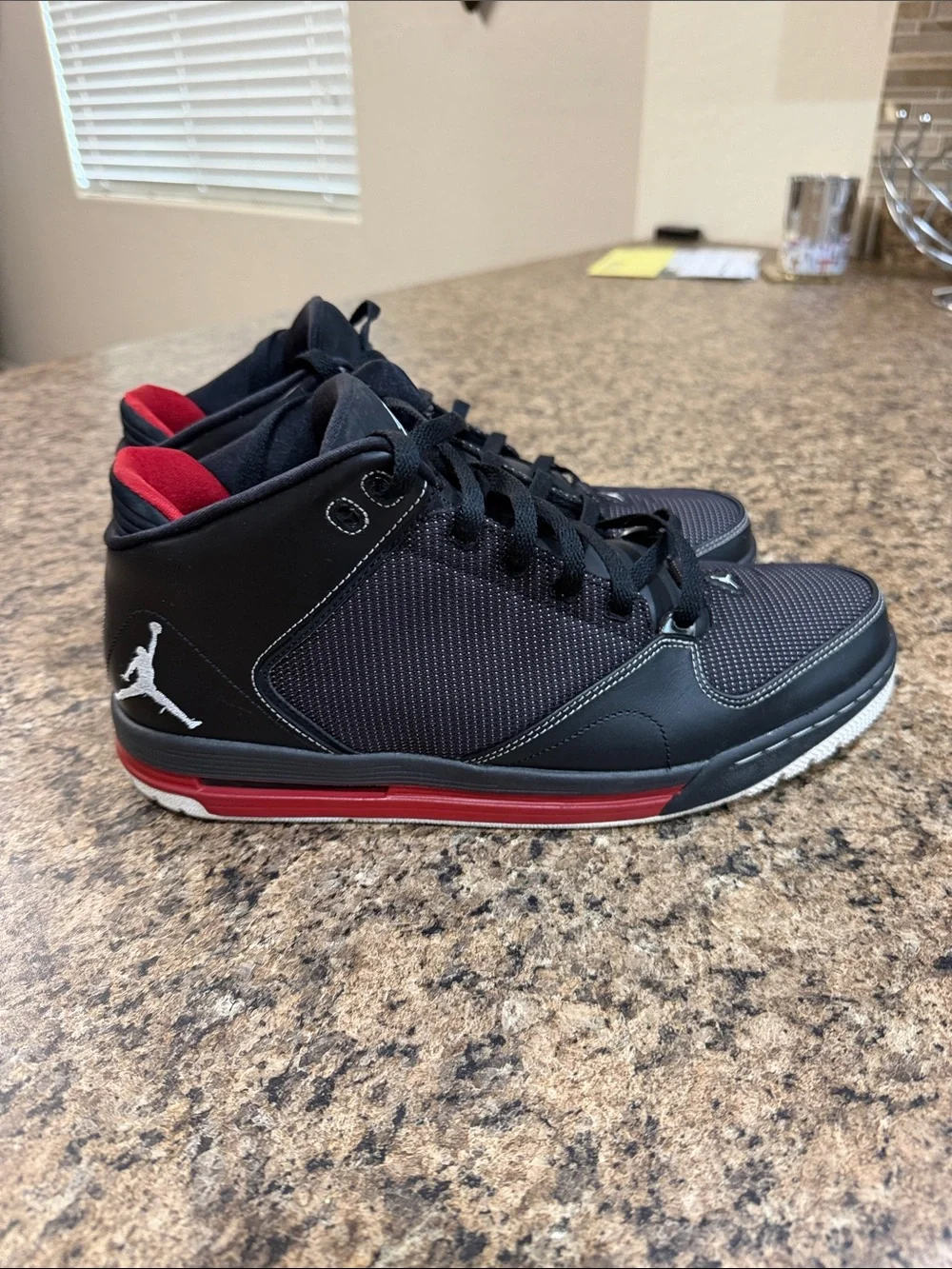 Jordan As-You-Go Men’s Black with Red Accents Mid-Top Sneakers